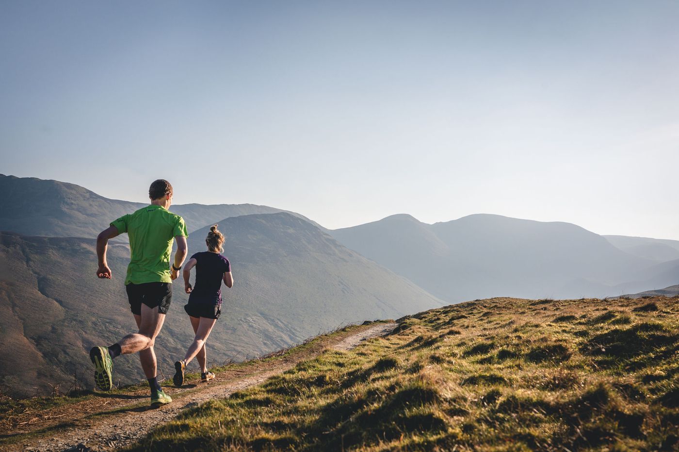 Brennan and Kat Townshend, fell and trail running coaches, on a Lake District ridge