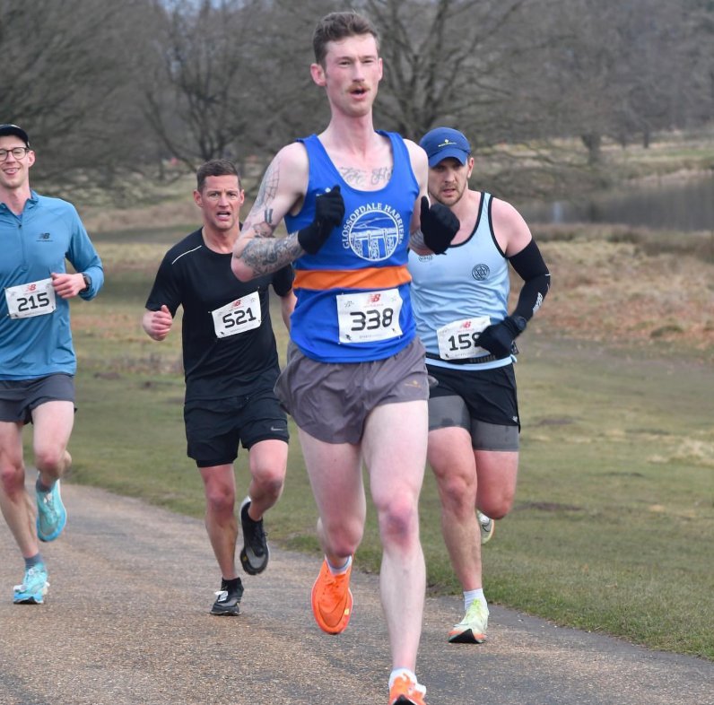 Alec racing a 10K road race in his Glossopdale Harriers vest