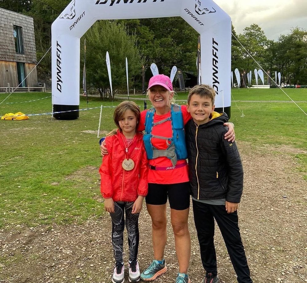 Debra with her children at The Lap finish arch