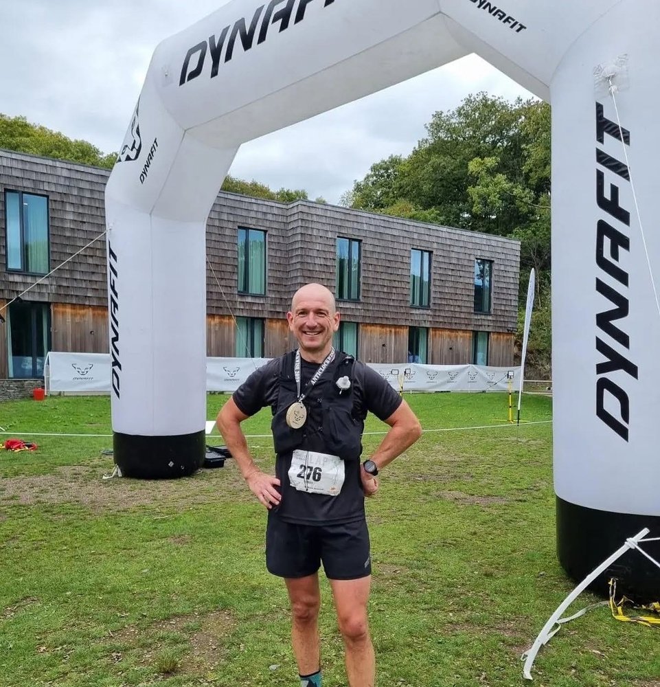 Mark finishing The Lap with his medal, 6th overall