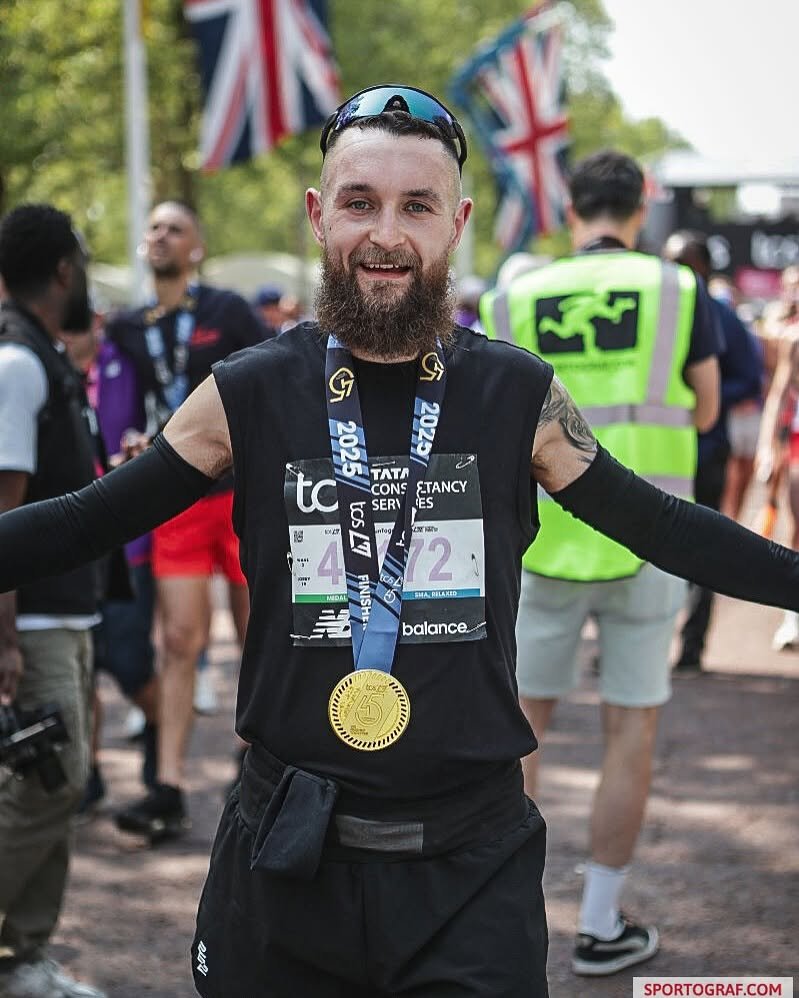 Matt with his finisher medal on The Mall after the London Marathon 2025