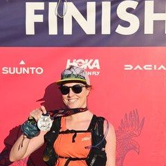 Hollie, coached by Kat Townshend, with her finisher medal at Ultra-Trail Snowdonia 50km