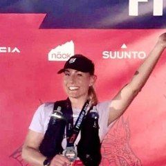 Laura, coached by Kat Townshend, with her medal after an ultra finish